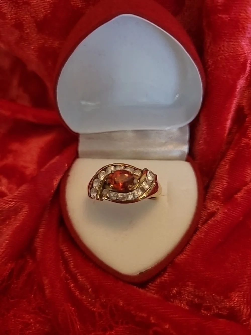 1.25ct. Spessartite Garnet Surrounded By 14 Sparkling Diamonds!